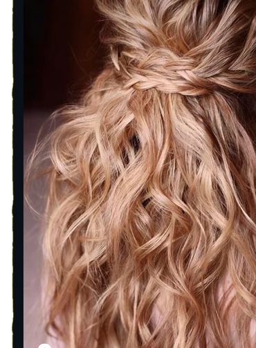 Curled and braided half up and half down updo.