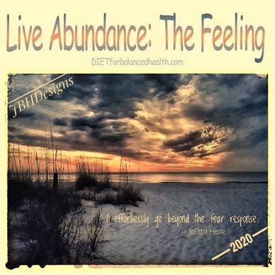 Intention-Live Abundance: The Feeling.  Blue and orange sunset over ocean at sandy beach with grass.