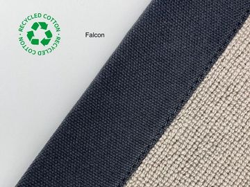 Close-up of Falcon fabric made from recycled cotton, showing texture and eco-friendly label.