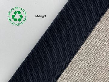 Close-up of recycled cotton fabric swatches in midnight and beige colors.
