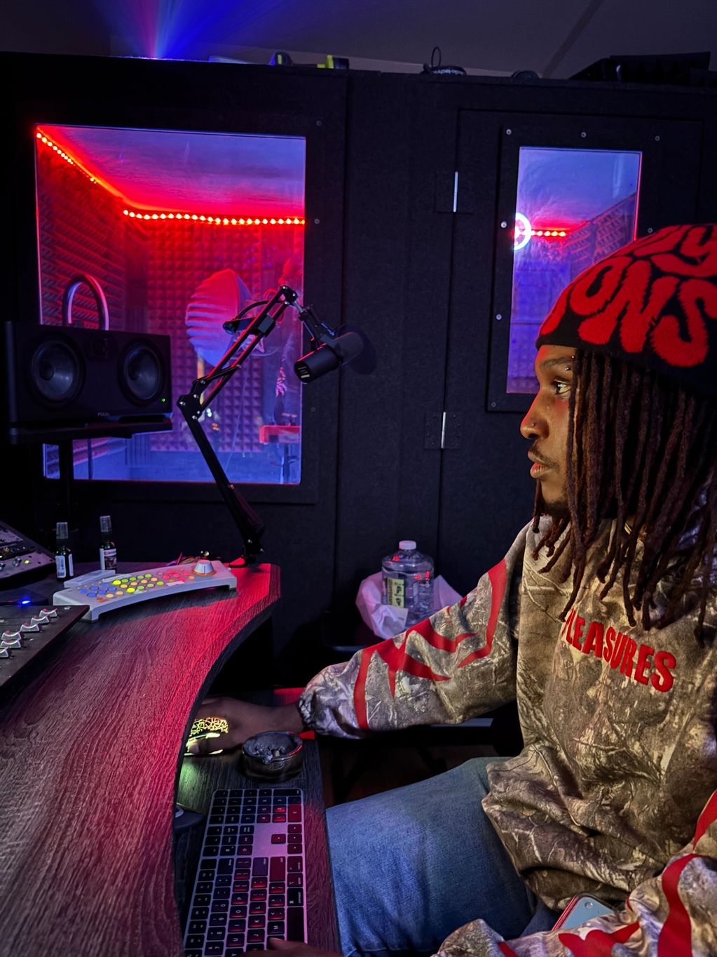 Man working in a colorful music studio.