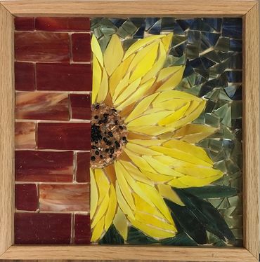 Sunflower against brick wall stained glass mosaic