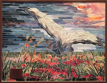 bird in a filed of flowers