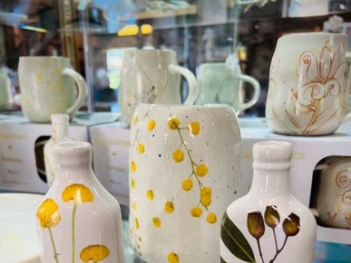 Ceramic vases with artistic floral designs.