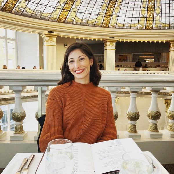 Woman Smiling in a grand building