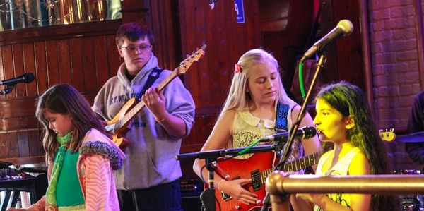 Gulf Coast School of Music students play guitar and piano and sing in Pensacola music school show