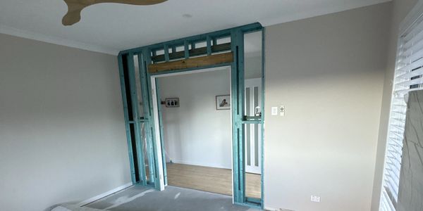 Room under renovation with exposed framing.