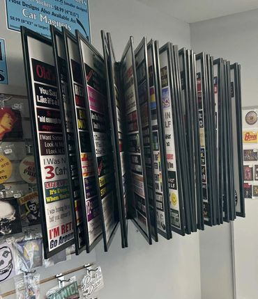 Display rack with humorous and novelty car stickers in a store.