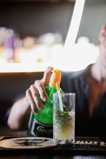 adding soda to the cocktail