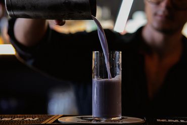pouring a cocktail in the glass