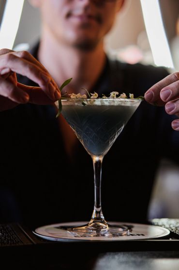 garnishing a cocktail