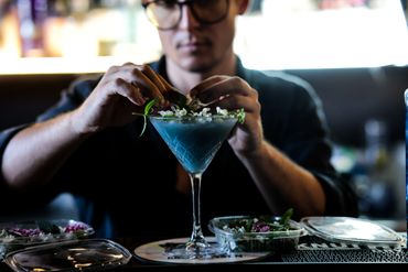 garnishing a signature cocktail