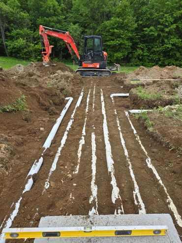 A Conventional Pipe and Stone trench septic field.