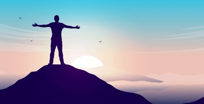 an individual on top of the mountain.