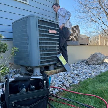 Upstate Air team member servicing outdoor system
