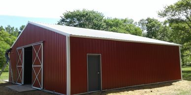 30x40x10 Texwin agriculture hay and equipment metal barn with sliding 10x10 doors.
