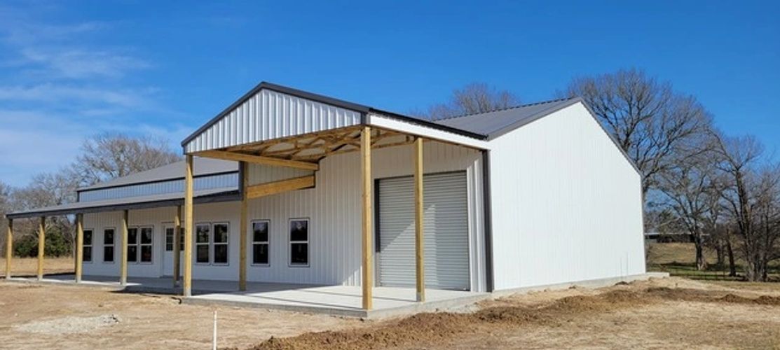 Texwin - Winslow's Pole Barn.  White with charcoal trim.  30x80x12 installed on concrete foundation.