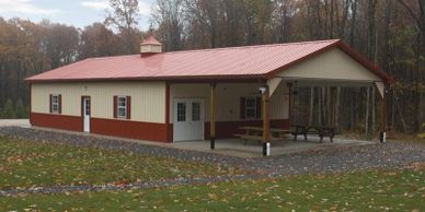 30x80x10 Texwin pole building event barn with covered porch and sitting area and cupola.