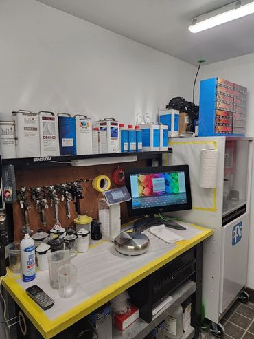 Organized automotive paint mixing station.