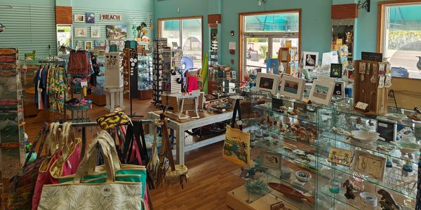 A colorful souvenir shop with various beach-themed items and accessories.