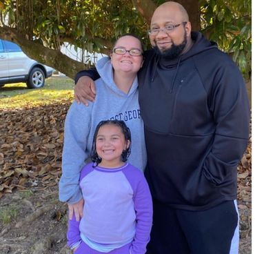 Erin's family, husband C.J., and daughter Lilly.