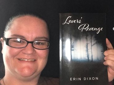 Erin Dixon and holding her debut novel.