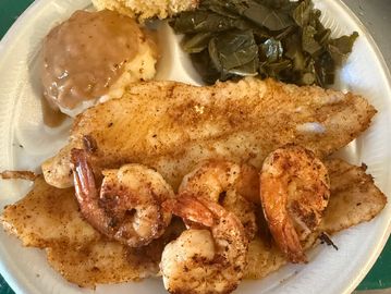 Enjoy grilled fish and shrimp with 2 sides of your choice .
