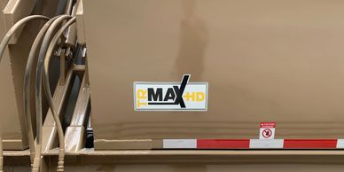 A picture of a logo on the side of a semi trailer.