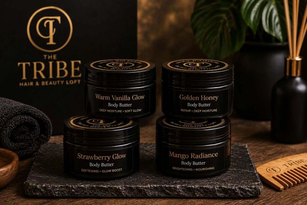 Four jars of body butter in a stylish setup.