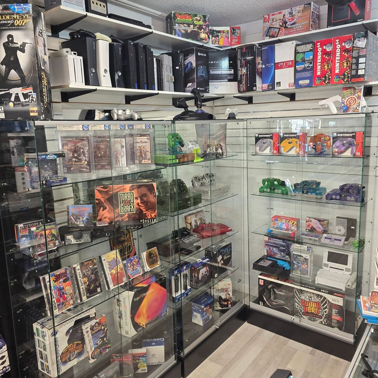 Bright Glass Cabinets Full of Video Games and Consoles at Retro Realm Kelowna BC