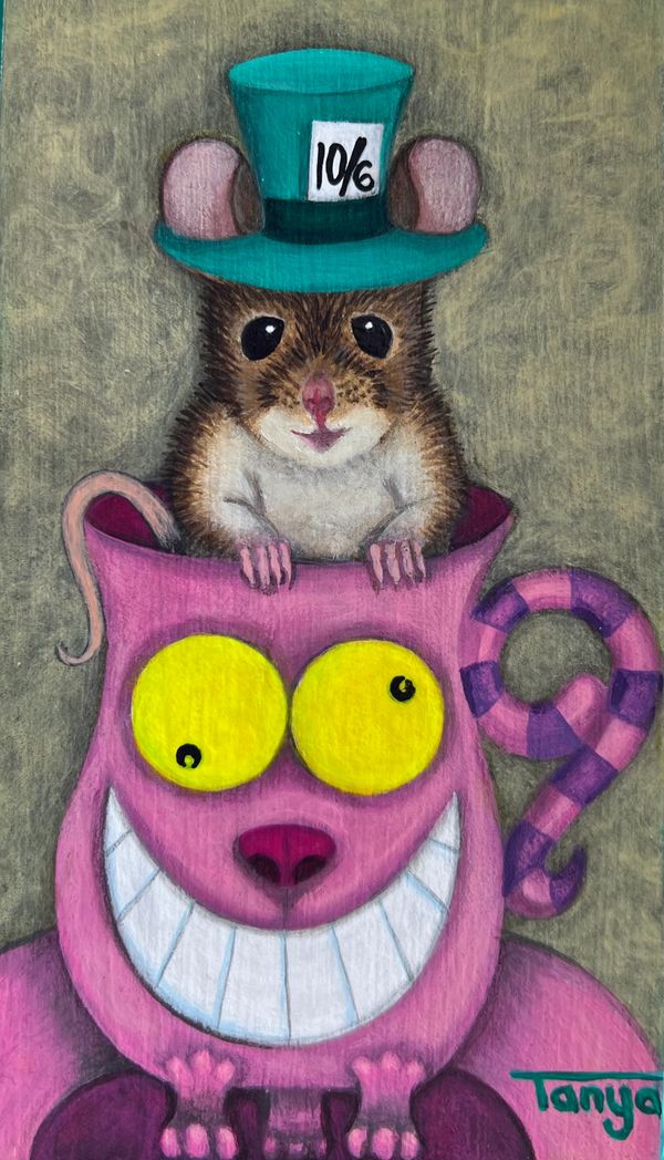 Mouse wearing Mad Hatter hat in a Cheshire Cat mug.