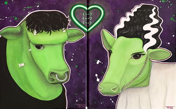 Cow and bull dressed like Frankenstein's monster and Bride of Frankenstein.