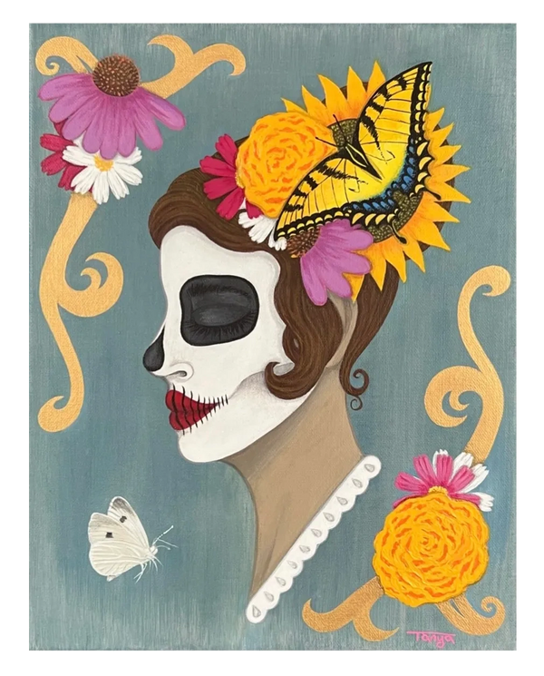 Woman with skull makeup with flowers and butterflies.