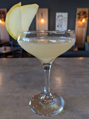 Cocktail with pears in a martini glass