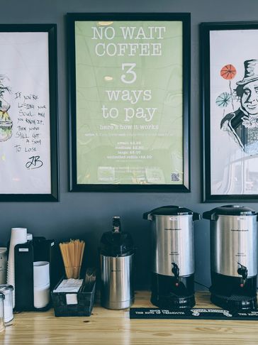 Self serve coffee urns with posters