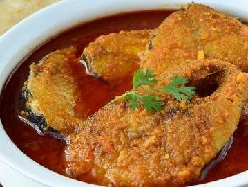 Fish Curry: A savory dish made with tender fish pieces simmered in a flavorful sauce consisting of