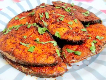 Fish Curry: A savory dish made with tender fish pieces simmered in a flavorful sauce consisting of