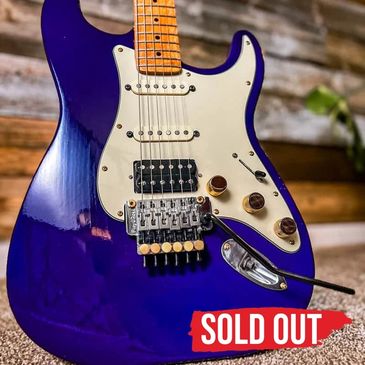 Sold out: Plum Paragon #1006, purple JTal guitar with cream pickguard