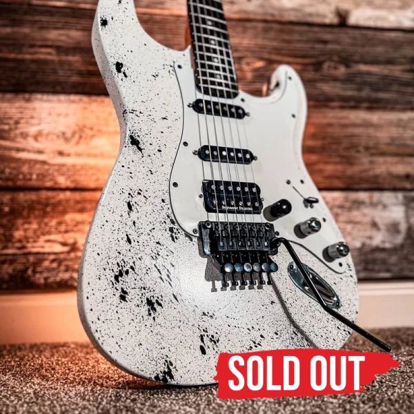 Sold out: Found the Leak #1014, white and black JTal guitar with a Floyd Rose bridge