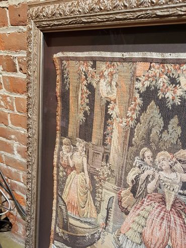 Hand embroidered textile framed with archival mounting and custom matting.