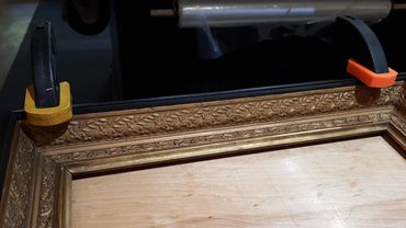 Repairing a broken picture frame corner in our Port Townsend framing workshop.