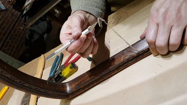 Repairing and mounting a vintage decorative fan for custom framing display.