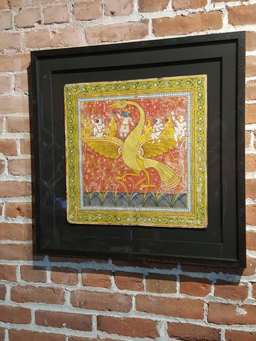 Hand embroidered textile framed with archival mounting and custom matting.