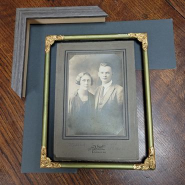 Portrait artwork custom framed after frame repair and restoration.