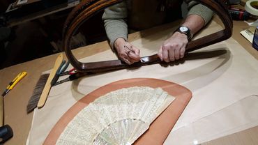 Repairing and mounting a vintage decorative fan for custom framing display.
