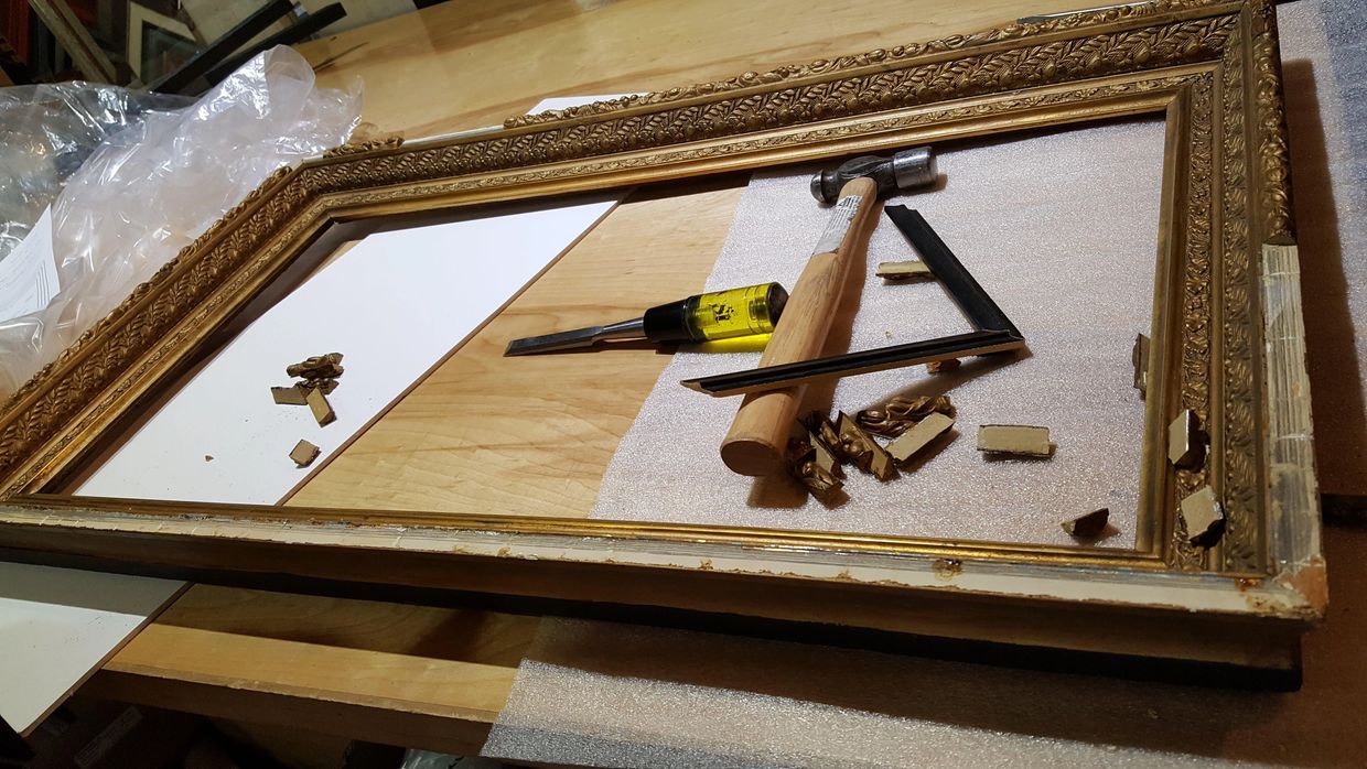 Repairing a broken picture frame corner in our Port Townsend framing workshop.