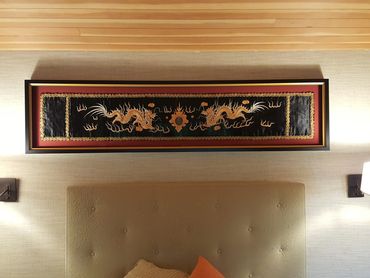 Fabric art panel custom framed to preserve delicate textile materials.