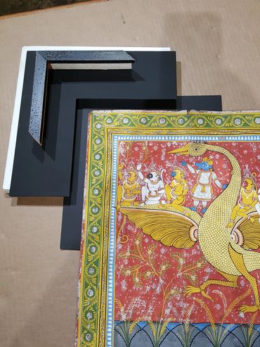 Hand embroidered textile framed with archival mounting and custom matting.