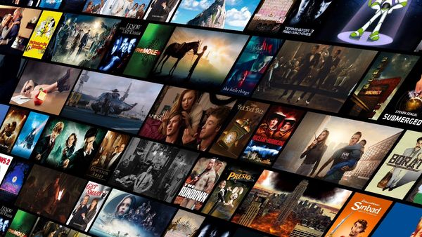 A collage of various movie and TV show posters displayed in a tilted grid.