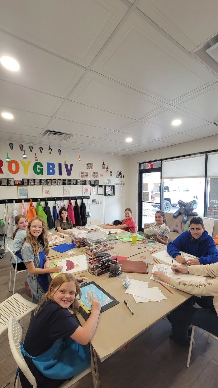 Children enjoying an art class, drawing and coloring together.